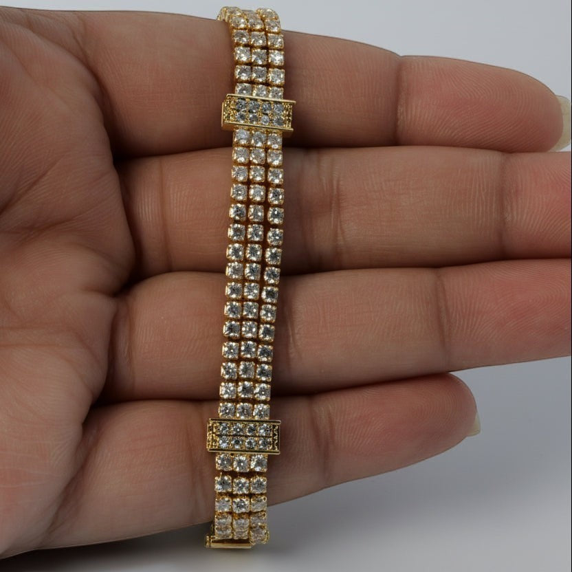 SVORA Triple Layer Tennis Bracelet with three rows of shimmering cubic zirconia stones in a gold-tone finish.