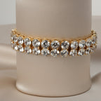 SVORA gold plated stainless steel twin row crystal tennis bracelet with round white CZ stones.