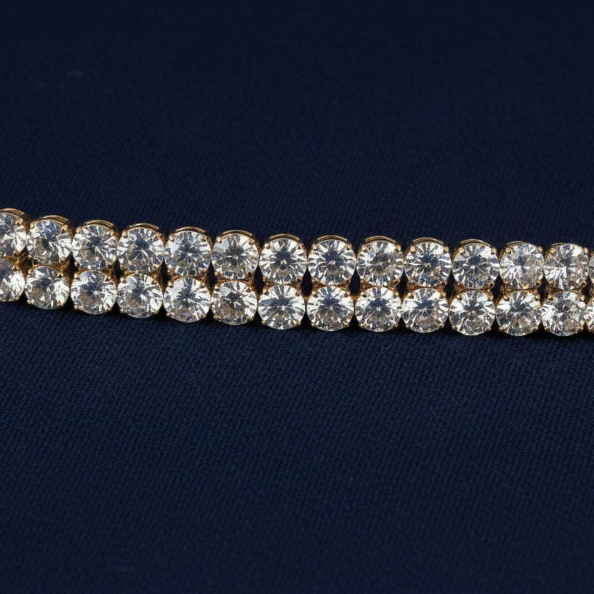 SVORA gold-plated stainless steel twin row crystal tennis bracelet with white CZ stones.