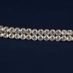 SVORA gold-plated stainless steel twin row crystal tennis bracelet with white CZ stones.