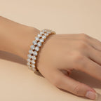 SVORA gold plated stainless steel twin row crystal tennis bracelet with white CZ stones.