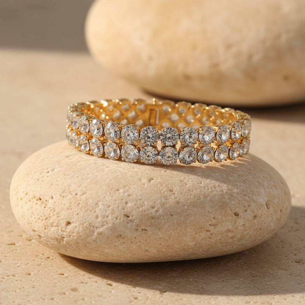 SVORA gold-plated stainless steel twin row crystal tennis bracelet with white CZ stones and fold-over clasp.