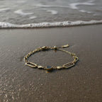 SVORA gold twisted rope chain bracelet with a black heart charm and oval links. Waterproof, anti-tarnish.