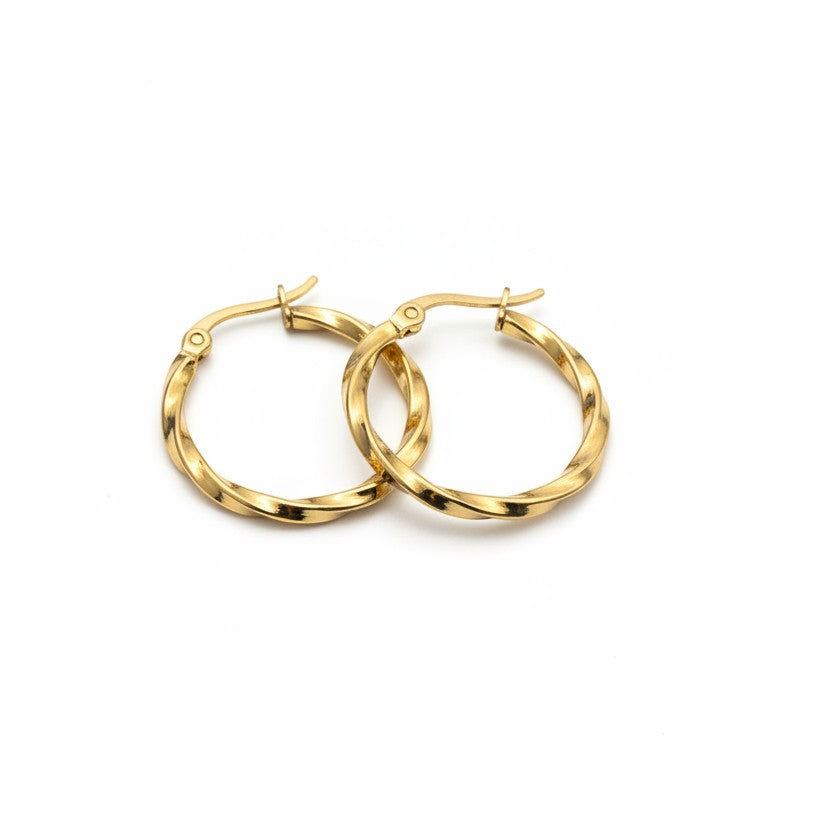 SVORA gold twisted hoop earrings made of stainless steel with a polished finish. Sculptural, rounded silhouette with textured detail.