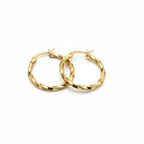 SVORA gold twisted hoop earrings made of stainless steel with a polished finish. Sculptural, rounded silhouette with textured detail.