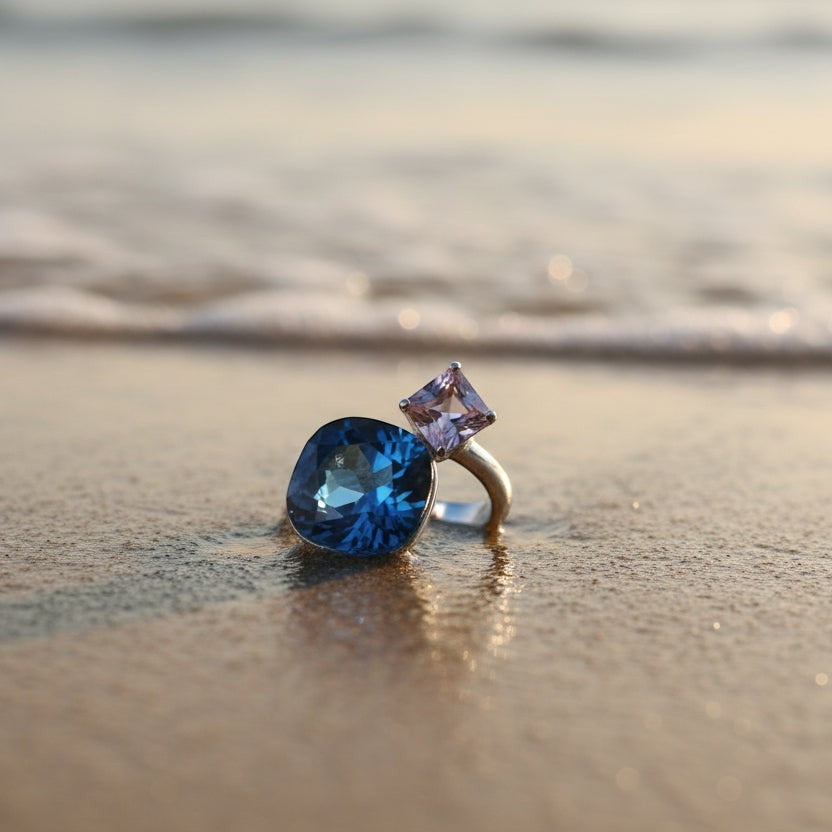 SVORA Toi et Moi Velvet Tanzanite Ring with blue cushion and purple cube stones on silver band.