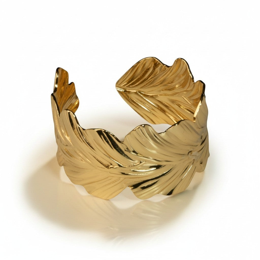 SVORA gold-plated stainless steel wavy leaf cuff bracelet, adjustable and hypoallergenic.