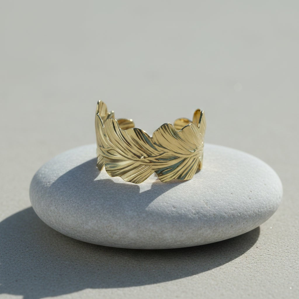 SVORA gold plated stainless steel wavy leaf cuff bracelet, adjustable and hypoallergenic.