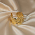 SVORA gold plated stainless steel wavy leaf cuff bracelet, adjustable and hypoallergenic.