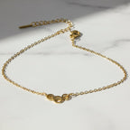 SVORA gold plated stainless steel bracelet with three openwork circles on a delicate chain. Adjustable, lobster clasp.