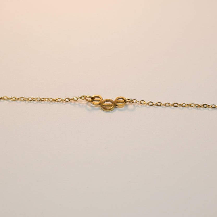 SVORA gold plated stainless steel Whisper Circle Chain Bracelet with three openwork circles.