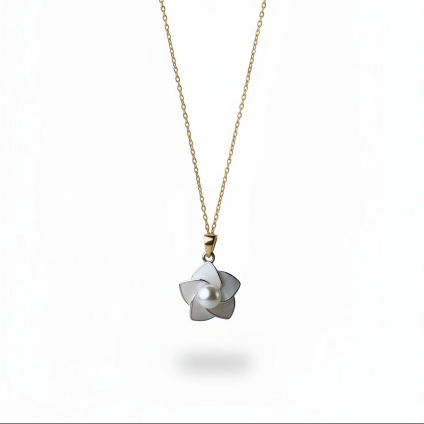 SVORA white enamel pearl flower necklace with a gold chain. Delicate floral pendant with a faux pearl center.