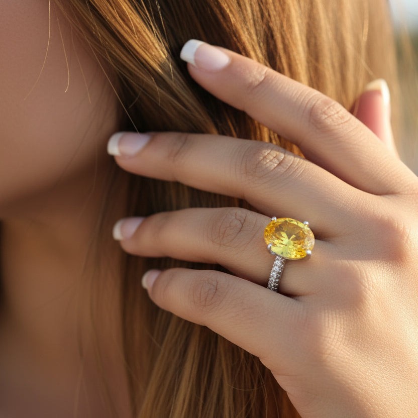 SVORA Ethereal Yellow Sapphire Solitaire Ring with pavé shoulders on a rhodium-plated stainless steel band.